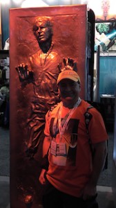 Nick Iandolo stands next to a full-size Han Solo frozen in carbonite.