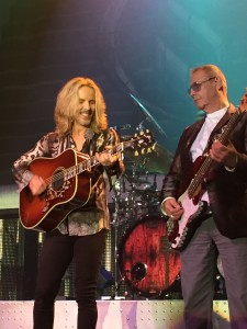 Tommy Shaw (acoustic guitar) with Chuck Panozzo on Bass; Photo Credit: Lori Mars