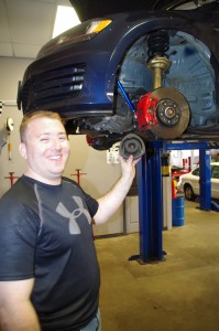 Nick Wadlinger, customer at Gearhead Systems, holds the strut heading into his Volkswagen GTI. (Photo: Michael Bilow)
