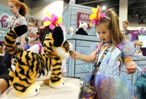 Luca Mammarell plays with the FurReal RoarinÕ Tyler, The Playful Tiger at the FurReal booth at HASCON on Sunday, Sept. 10, 2017.